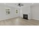 A living room with hardwood floors and a modern fireplace at 2221 Blue Bayou Blvd, Johns Island, SC 29455