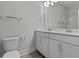 A double sink bathroom vanity featuring white cabinets, tile floors, and modern fixtures at 2225 Blue Bayou Blvd, Johns Island, SC 29455