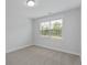A bright bedroom enhanced by a window offering natural light and serene views at 2225 Blue Bayou Blvd, Johns Island, SC 29455