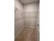 Walk-in closet featuring carpet flooring and wire shelving for ample storage space at 2225 Blue Bayou Blvd, Johns Island, SC 29455