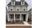 Charming two-story home with a welcoming front porch and neutral siding at 2225 Blue Bayou Blvd, Johns Island, SC 29455