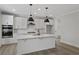 Modern kitchen featuring white cabinets, stainless appliances, and a marble island at 2225 Blue Bayou Blvd, Johns Island, SC 29455