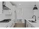 Bright kitchen with marble counters, white herringbone backsplash, and stainless appliances at 2225 Blue Bayou Blvd, Johns Island, SC 29455