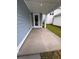Covered patio featuring a concrete floor, blue siding and plenty of natural light at 2225 Blue Bayou Blvd, Johns Island, SC 29455