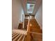 Hardwood staircase featuring white railings and a skylight providing an abundance of natural light at 2225 Blue Bayou Blvd, Johns Island, SC 29455