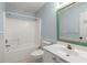 A blue tiled bathroom features a tub and shower, toilet, and sink at 228 Two Pond Loop, Ladson, SC 29456