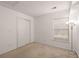 A bedroom with light carpet, neutral walls, closet, and a window with blinds at 228 Two Pond Loop, Ladson, SC 29456