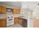 Kitchen view with white appliances and cabinetry at 228 Two Pond Loop, Ladson, SC 29456