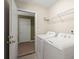 The laundry room is equipped with a washer and dryer and overhead shelving at 228 Two Pond Loop, Ladson, SC 29456