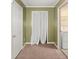Small room with white walls, carpet, and access to a laundry room at 228 Two Pond Loop, Ladson, SC 29456