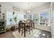 Inviting breakfast nook with large windows, a dining table, and lots of natural light at 2379 Lenwick Hall Ln, Johns Island, SC 29455