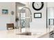 Modern kitchen sink features a gooseneck faucet and white countertops at 2379 Lenwick Hall Ln, Johns Island, SC 29455