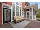 Cozy back porch with sofa and door to backyard at 2786 Parkers Landing Rd, Mount Pleasant, SC 29466