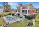 Aerial view of backyard with pool, outdoor bar, outdoor seating, and lush landscaping at 2786 Parkers Landing Rd, Mount Pleasant, SC 29466