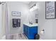 Fresh bathroom design with a painted vanity, updated lighting, and charming decor at 2786 Parkers Landing Rd, Mount Pleasant, SC 29466
