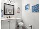 Stylish half bathroom with updated vanity, modern fixtures, and decorative wall art at 2786 Parkers Landing Rd, Mount Pleasant, SC 29466