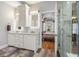 Double vanity bathroom leading into primary bedroom with glass shower and modern fixtures at 2786 Parkers Landing Rd, Mount Pleasant, SC 29466