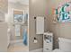 Charming bathroom featuring coastal decor, a window for natural light, and a clean, functional layout at 2786 Parkers Landing Rd, Mount Pleasant, SC 29466