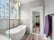 Spa-like bathroom featuring a soaking tub, glass shower and stylish vanity at 2786 Parkers Landing Rd, Mount Pleasant, SC 29466