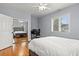 Bedroom with hardwood floors, a window, and double doors to another bedroom space at 2786 Parkers Landing Rd, Mount Pleasant, SC 29466