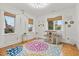 Versatile flex space with bright white walls, unique lighting, hardwood floors, and sunny windows at 2786 Parkers Landing Rd, Mount Pleasant, SC 29466