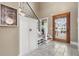 Welcoming foyer with staircase, built-in storage, and decorative accents at 2786 Parkers Landing Rd, Mount Pleasant, SC 29466