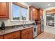 Kitchen features a large window, stainless appliances, granite counters, and custom wood cabinets at 2786 Parkers Landing Rd, Mount Pleasant, SC 29466
