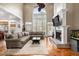 Bright living room features hardwood floors, fireplace, and large windows at 2786 Parkers Landing Rd, Mount Pleasant, SC 29466