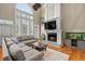 Inviting living room features a fireplace, a large sectional sofa, and hardwood floors at 2786 Parkers Landing Rd, Mount Pleasant, SC 29466