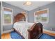 Comfortable main bedroom featuring natural light from two windows, a hardwood bedframe, and hardwood flooring at 2786 Parkers Landing Rd, Mount Pleasant, SC 29466