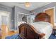Main bedroom featuring a dark wood bed frame, hardwood floors, and a light gray color scheme at 2786 Parkers Landing Rd, Mount Pleasant, SC 29466