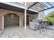 Inviting outdoor patio with brick archways, seating, and stone accents at 2786 Parkers Landing Rd, Mount Pleasant, SC 29466