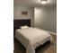 Comfortable bedroom boasts wood floors, a gray color scheme, and a tranquil retreat at 2905 Sweetleaf Ln, Johns Island, SC 29455