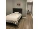 Comfortable bedroom boasts wood floors, a gray color scheme, and a tranquil retreat at 2905 Sweetleaf Ln, Johns Island, SC 29455