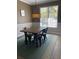 Charming dining room with wood table, metal chairs, and stylish light fixture at 2905 Sweetleaf Ln, Johns Island, SC 29455