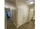Bright hallway features wood floors, access to bedrooms, and a bathroom, offering a convenient layout at 2905 Sweetleaf Ln, Johns Island, SC 29455