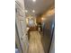 The kitchen offers stainless appliances, ample counter space, wood cabinets, and wood-look flooring at 2905 Sweetleaf Ln, Johns Island, SC 29455