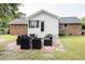 Backyard featuring outdoor seating area, brick accents, and manicured lawn at 2916 Marginal Rd, Charleston, SC 29414