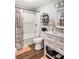 Bathroom featuring a combined shower and tub, neutral color palette and stylish storage options at 2916 Marginal Rd, Charleston, SC 29414