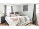 Bright bedroom with a well-lit window, a luxurious bed with lots of pillows, and modern decorations at 2916 Marginal Rd, Charleston, SC 29414