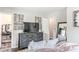 Inviting bedroom featuring a sleek dresser with a TV and a comfy bed with soft, decorative pillows at 2916 Marginal Rd, Charleston, SC 29414