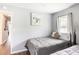 A calming bedroom featuring two twin beds, light-colored walls, and ample natural light at 2916 Marginal Rd, Charleston, SC 29414