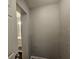 Hallway leading to bathroom featuring neutral colored walls at 2916 Marginal Rd, Charleston, SC 29414