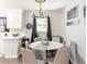 Cozy dining area adjacent to kitchen features a large, stylish chandelier at 2916 Marginal Rd, Charleston, SC 29414