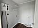 Functional laundry room with water heater and shelving at 2916 Marginal Rd, Charleston, SC 29414
