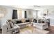 Comfortable living room featuring a plush sectional sofa and ample natural light at 2916 Marginal Rd, Charleston, SC 29414