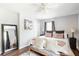 A well-lit main bedroom featuring soft textiles, neutral tones, and a full length mirror for added dimension at 2916 Marginal Rd, Charleston, SC 29414