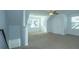Bright, spacious bonus room with ample natural light and neutral carpeting at 315 Flyway Rd, Goose Creek, SC 29445