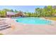 Large community pool with lounge seating and tables around it at 315 Flyway Rd, Goose Creek, SC 29445