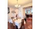 Elegant dining area boasting wood floors, seating for four, and a decorative tree wall hanging at 315 Flyway Rd, Goose Creek, SC 29445